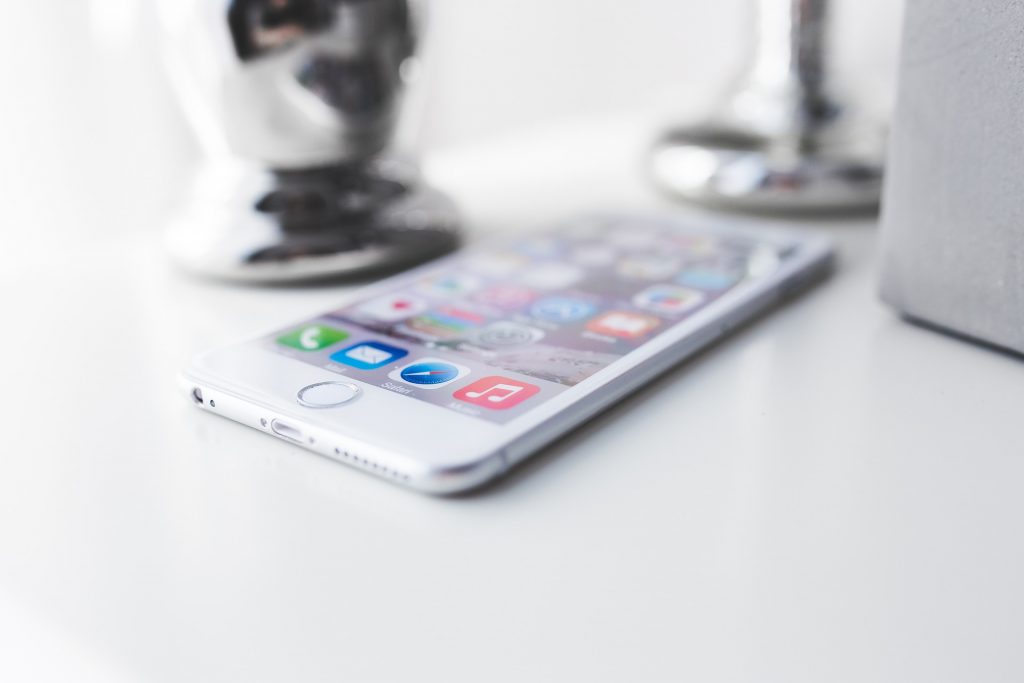 iPhone on white desk background