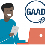 An illustration of a person using a laptop and smartphone, with the GAAD logo.