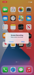 Screenshot of an iPhone home screen with a pop up from the Screen Recording app asking if you'd like to stop recording, with the options of Cancel or Stop.