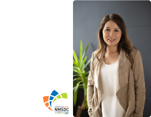 A portrait of co-founder and partner of PLUS QA, Audrey Bonnet. Included is a logo for NMSDC.
